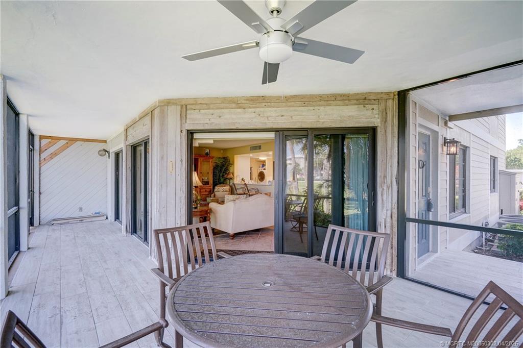 331 Golfview Circle Stuart, FL 34996 - Photo 18 of 39 a view of a hallway that has a bed and a table in it