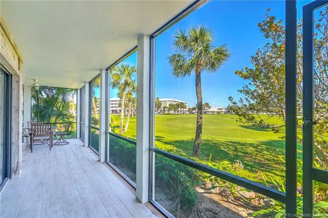 front view of a building with a garden