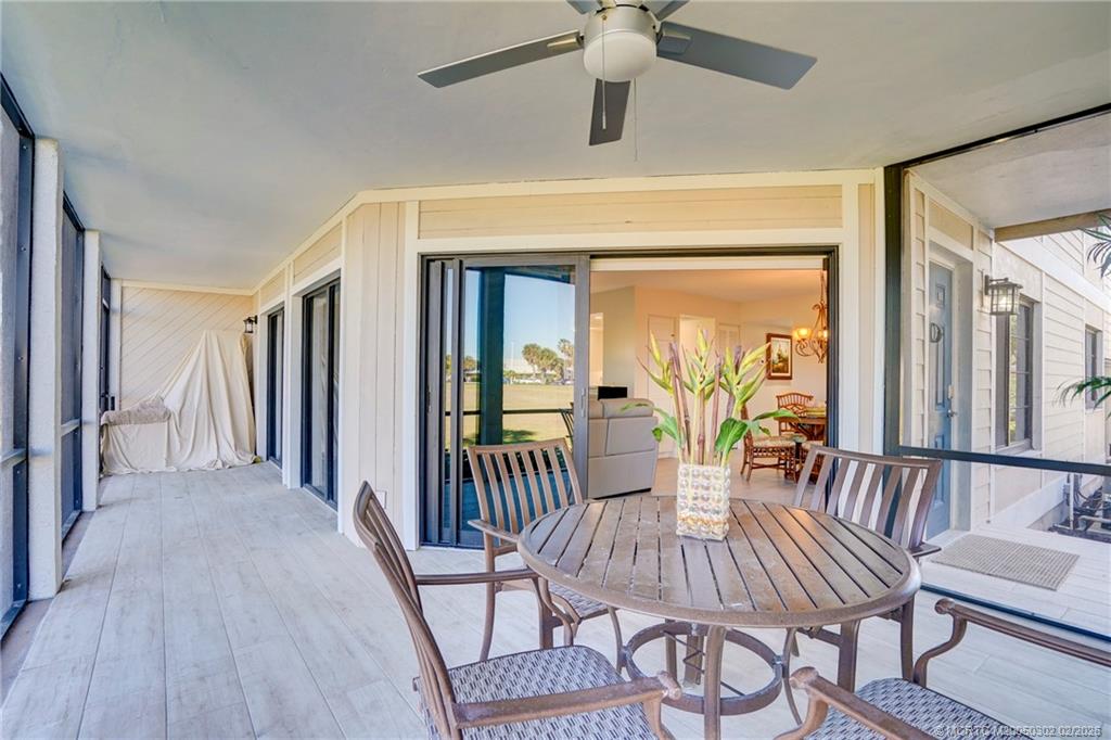 331 Golfview Circle Stuart, FL 34996 - Photo 20 of 48 a view of a dining room with furniture window and wooden floor