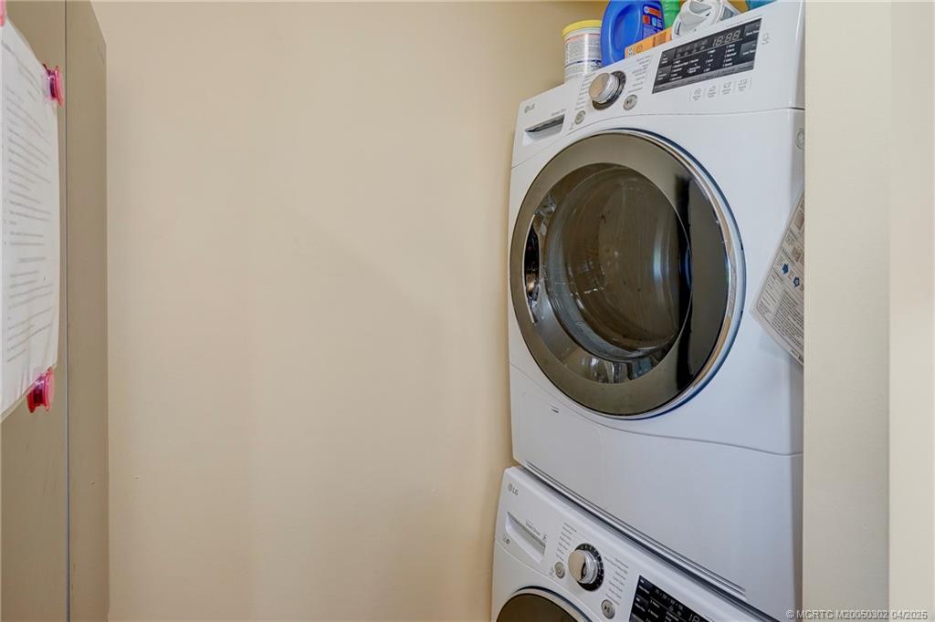 331 Golfview Circle Stuart, FL 34996 - Photo 25 of 39 a utility room with dryer and washer