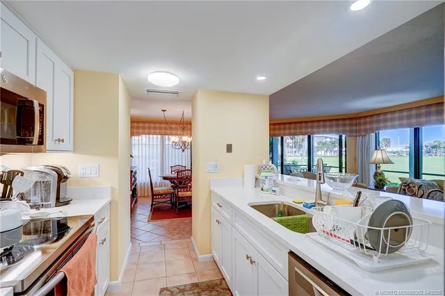 a bathroom with a sink a toilet and shower curtain