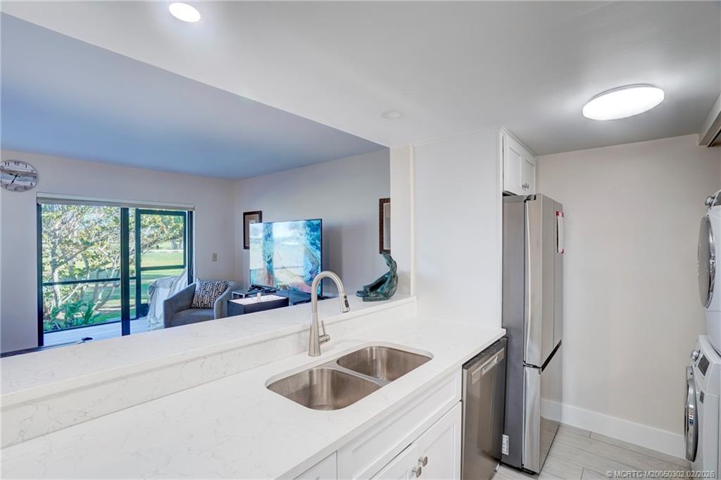 331 Golfview Circle Stuart, FL 34996 - Photo 36 of 48 a bathroom with a sink and mirror