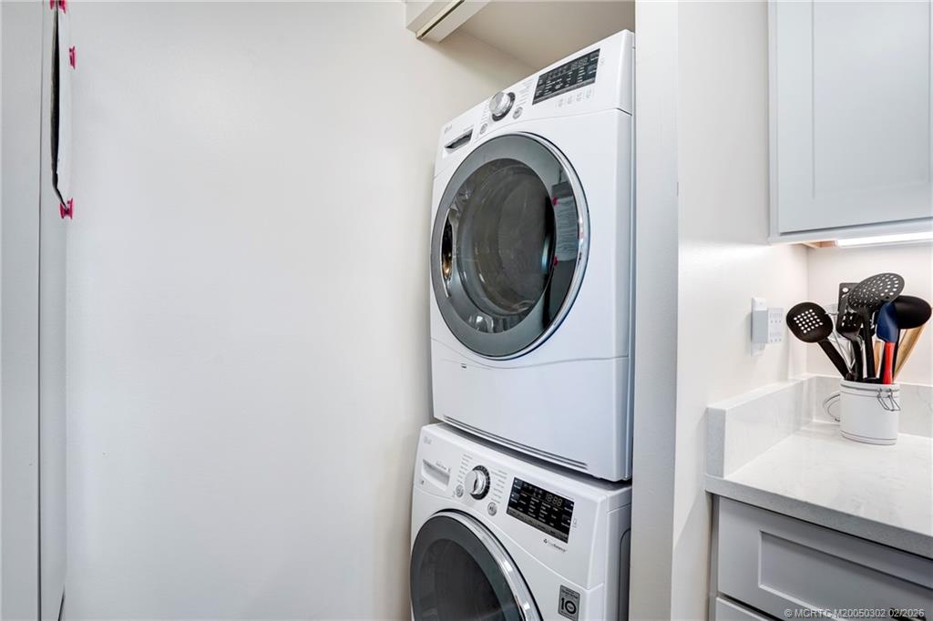 331 Golfview Circle Stuart, FL 34996 - Photo 37 of 48 a utility room with dryer and washer