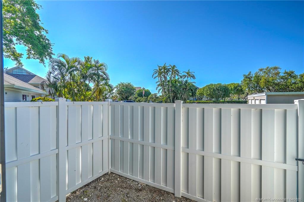 331 Golfview Circle Stuart, FL 34996 - Photo 37 of 39 a view of a wooden fence
