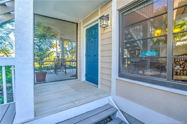 a dining room with wooden floor wooden floor and windows