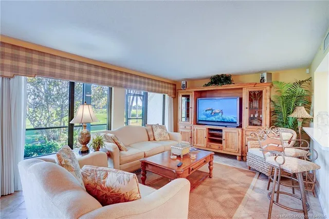 a very nice looking living room with a large window