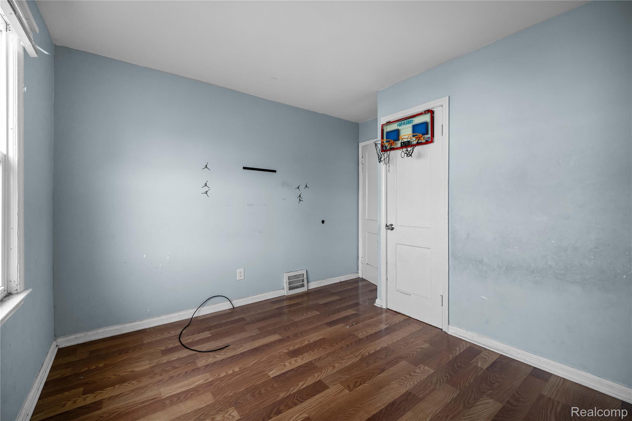 4049 Williams Street Inkster, MI 48141 - Photo 14 of 21 Empty room featuring dark wood finished floors and baseboards