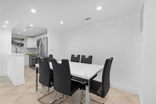 a large white bed in a white room