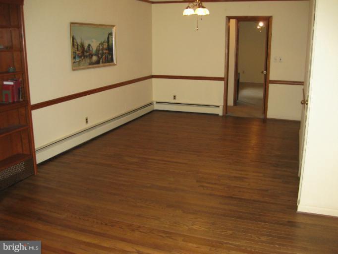 3734 Grave Run Road Manchester, MD 21102 - Photo 1 of 26 a view of an empty room with wooden floor