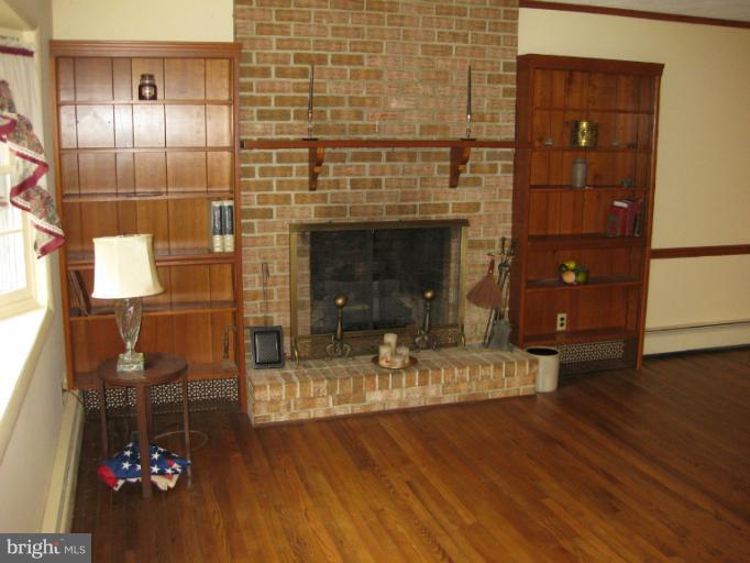 3734 Grave Run Road Manchester, MD 21102 - Photo 24 of 26 a living room with furniture and a fireplace