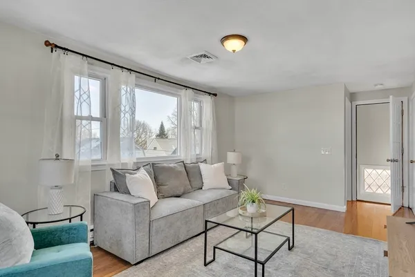 a living room with furniture and a large window