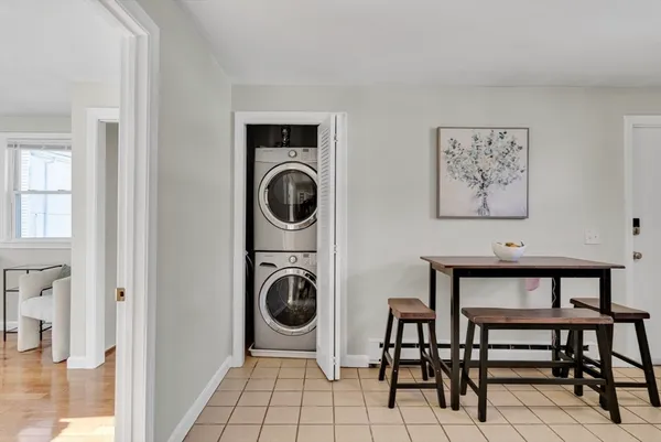 a view of a hallway with washer and dryer