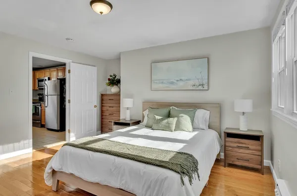 a bedroom with bed and walk in closet