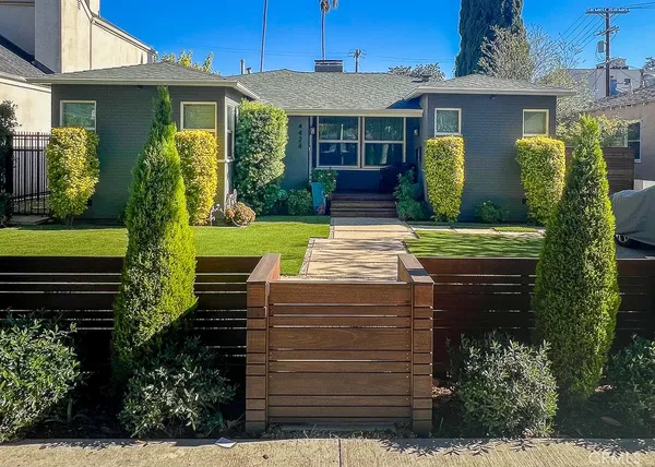 a view of a house with a garden