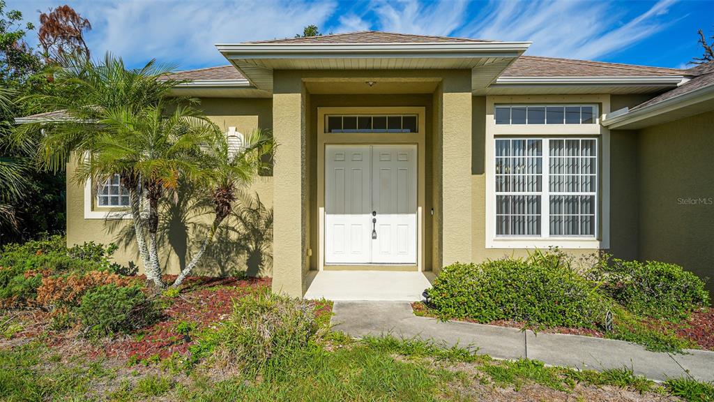 5279 Lovett Road North Port, FL 34288 - Photo 1 of 21 a front view of a house with a yard