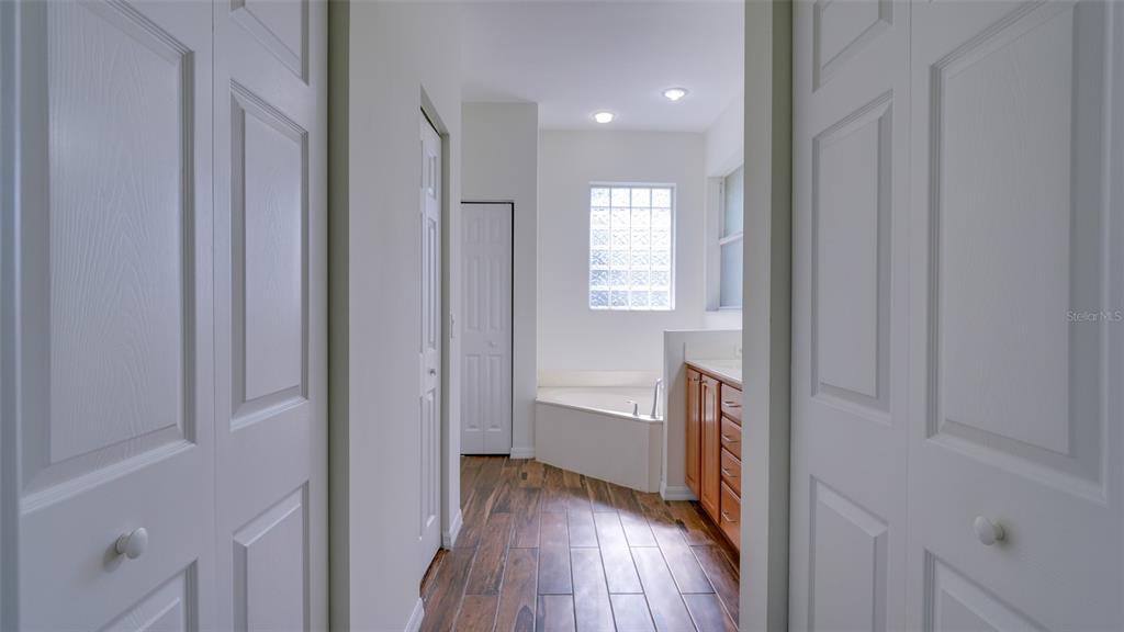 5279 Lovett Road North Port, FL 34288 - Photo 15 of 21 a view of hallway with a closet and wooden floor
