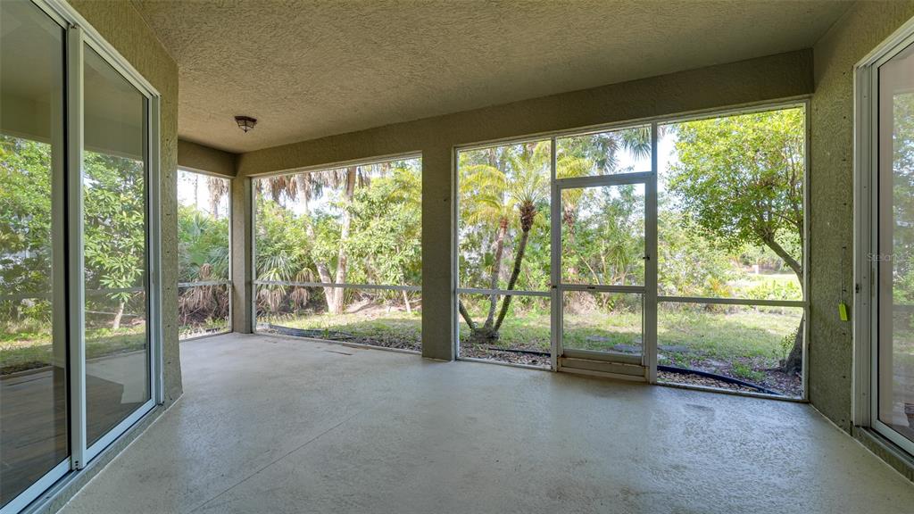 5279 Lovett Road North Port, FL 34288 - Photo 18 of 21 a view of room with floor to ceiling window