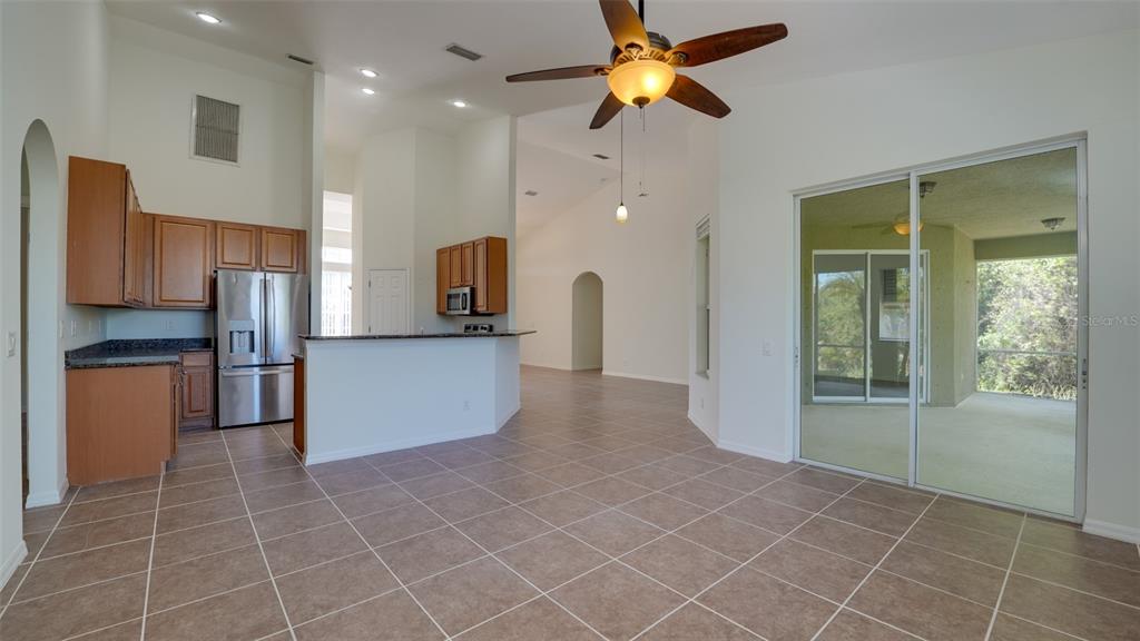 5279 Lovett Road North Port, FL 34288 - Photo 9 of 21 a view of a kitchen with a sink and a refrigerator