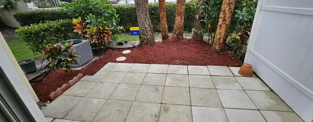 a view of a backyard with sitting area