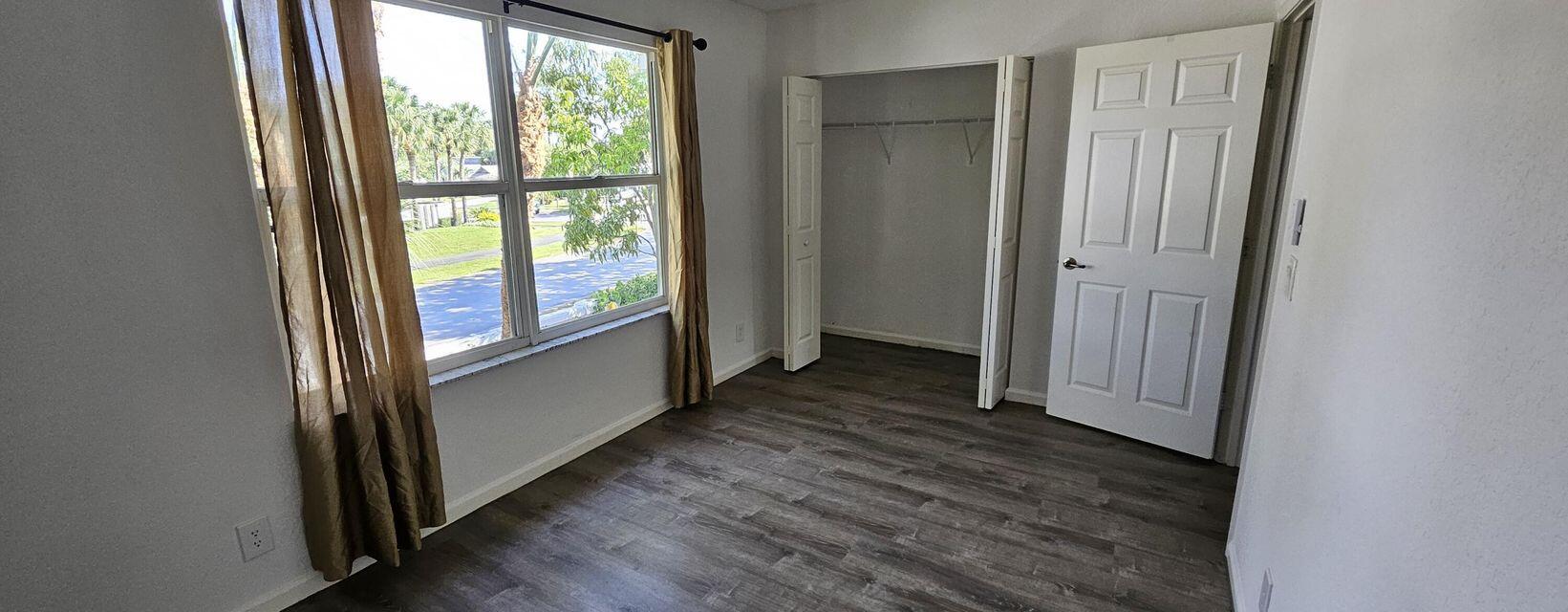 13490 Old Englishtown Road Wellington, FL 33414 - Photo 4 of 13 a view of front door with wooden floor