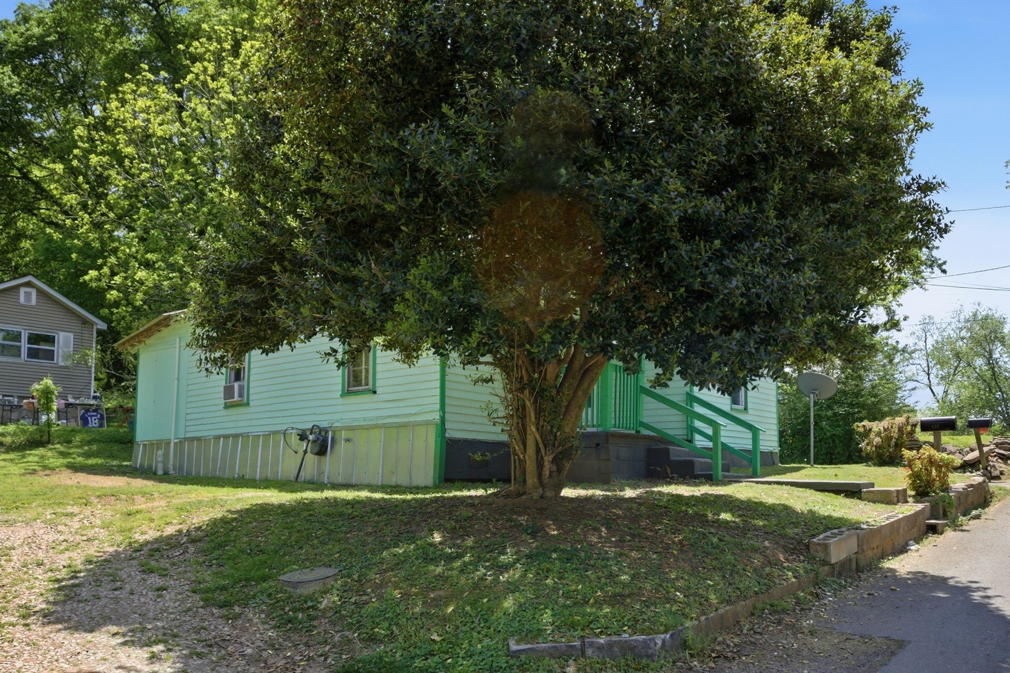 433 Jones Street Pulaski, TN 38478 - Photo 2 of 25 a view of a yard with plants and trees