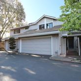 a front view of a house with a garage