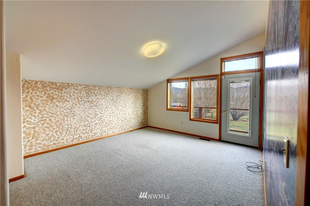 78 Woods Road Omak, WA 98841 - Photo 17 of 40 a view of an empty room with a window