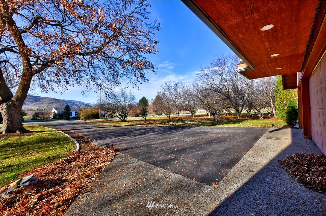 78 Woods Road Omak, WA 98841 - Photo 40 of 40 a view of a yard with large trees