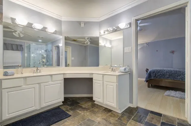 a spacious bathroom with a double vanity sink mirror and