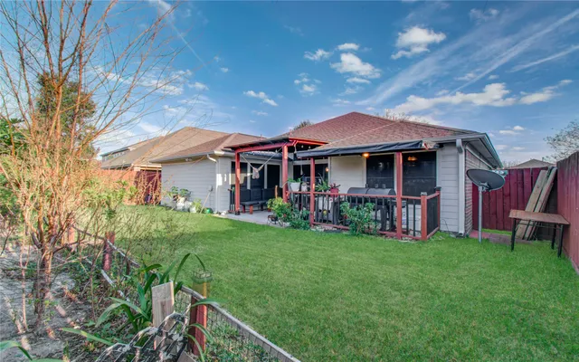 a view of yard with swimming pool and green space