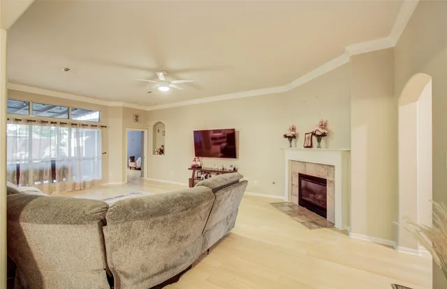 a living room with furniture and a fireplace