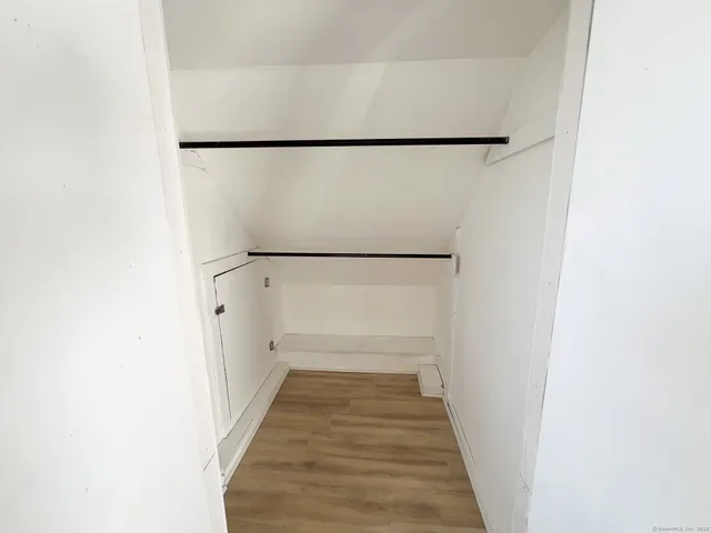 a hallway with wooden floor