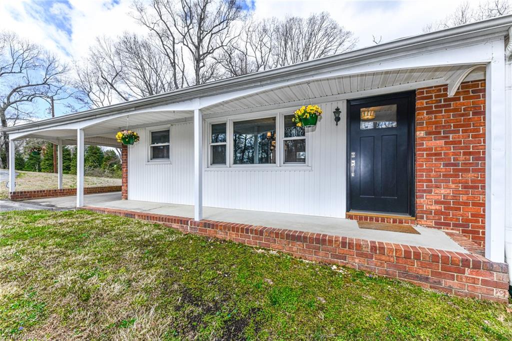 8302 Cadet Drive Oak Ridge, NC 27310 - Photo 11 of 42 Covered Front Porch