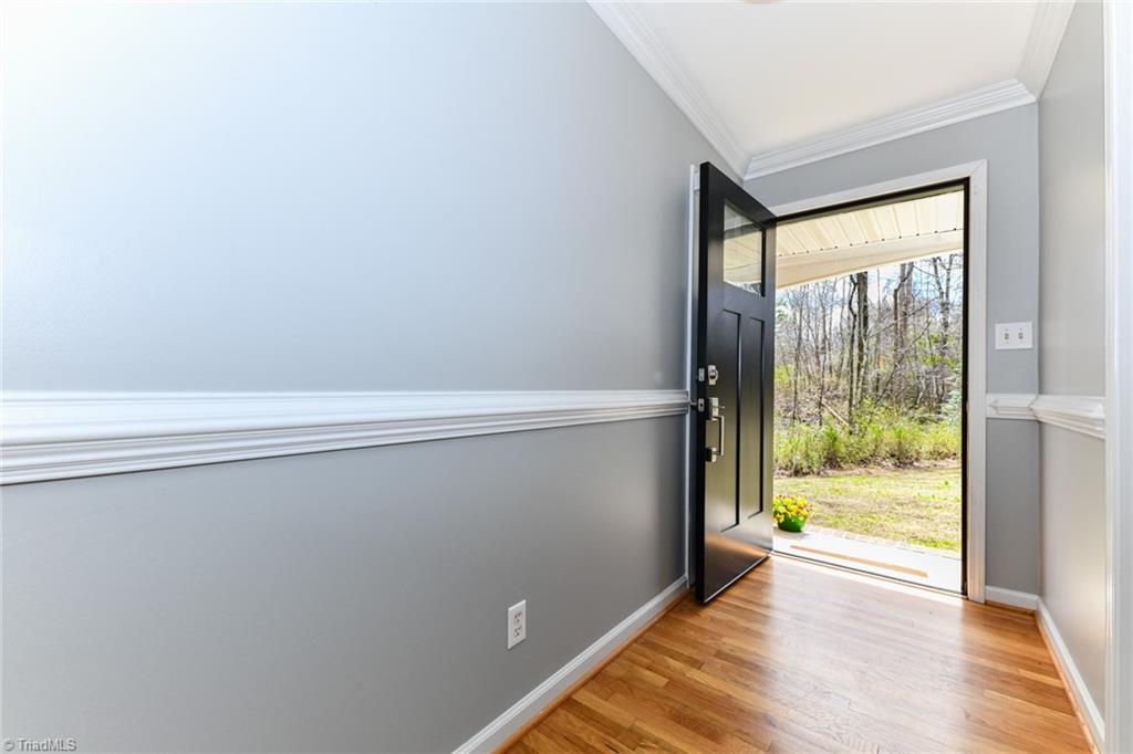 8302 Cadet Drive Oak Ridge, NC 27310 - Photo 14 of 42 Front Door Entrance with coat closet