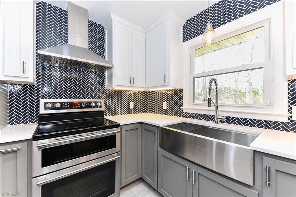 8302 Cadet Drive Oak Ridge, NC 27310 - Photo 23 of 42 SS Farm sink, Hood, and Oven