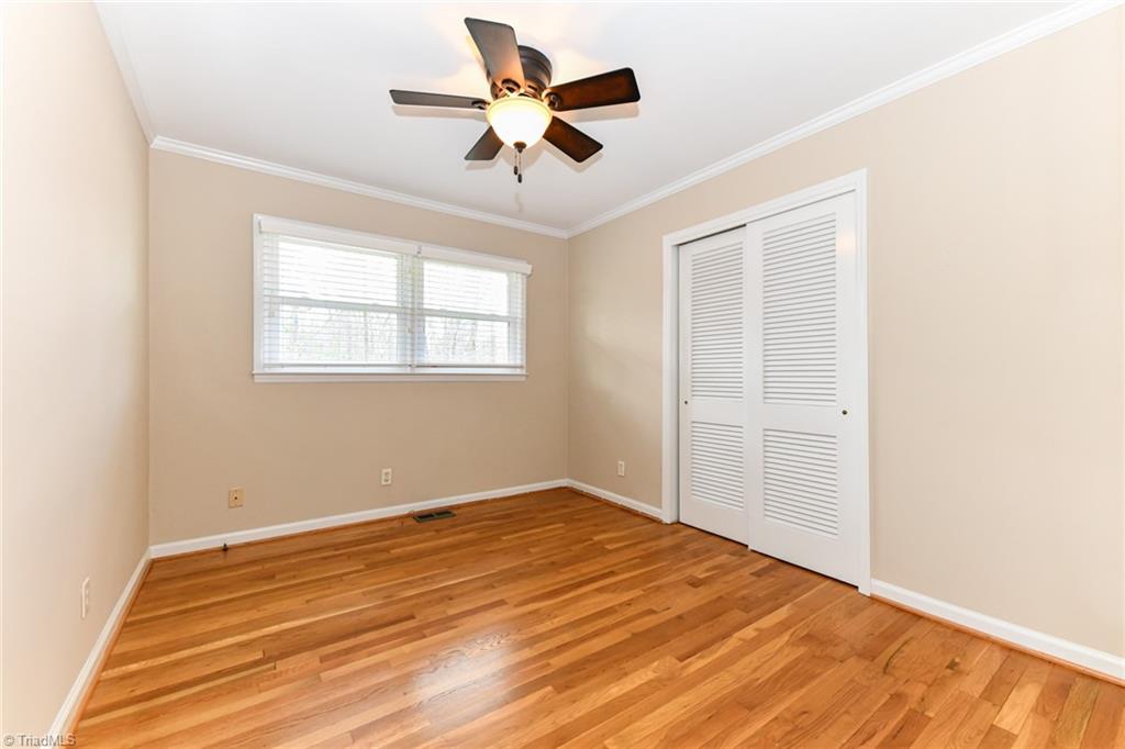 8302 Cadet Drive Oak Ridge, NC 27310 - Photo 28 of 42 2nd Bedroom with Ceiling Fan