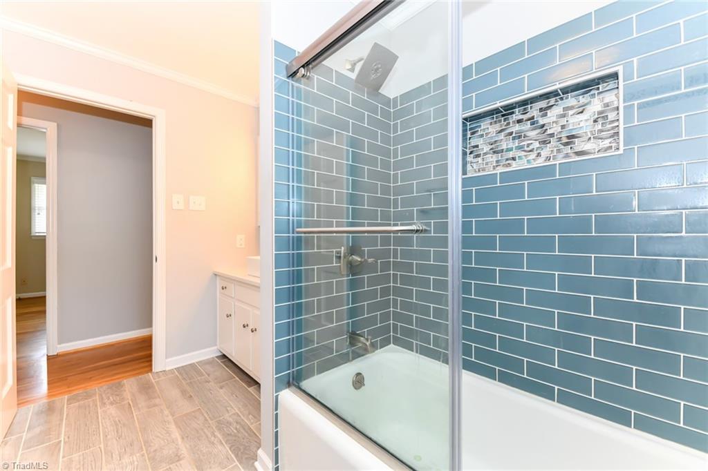 8302 Cadet Drive Oak Ridge, NC 27310 - Photo 33 of 42 Beautifully tiled Shower with Tub