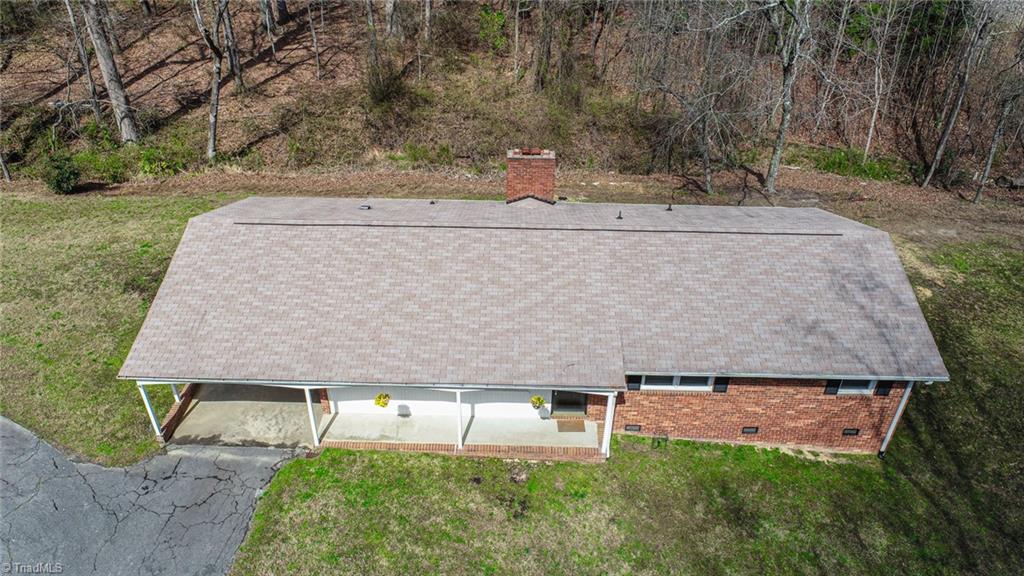 8302 Cadet Drive Oak Ridge, NC 27310 - Photo 4 of 42 Left side of house has been used for garden space