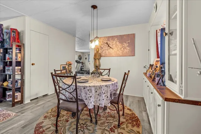 a kitchen with granite countertop a sink stove and cabinets