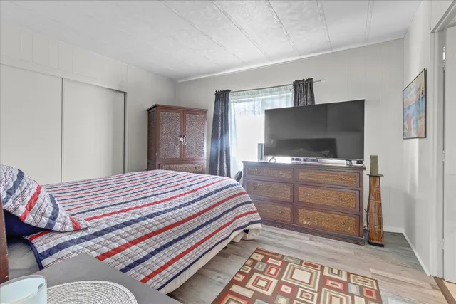 a bathroom with a double vanity sink and mirror with shower