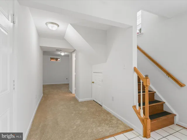 a view of a hallway view with staircase