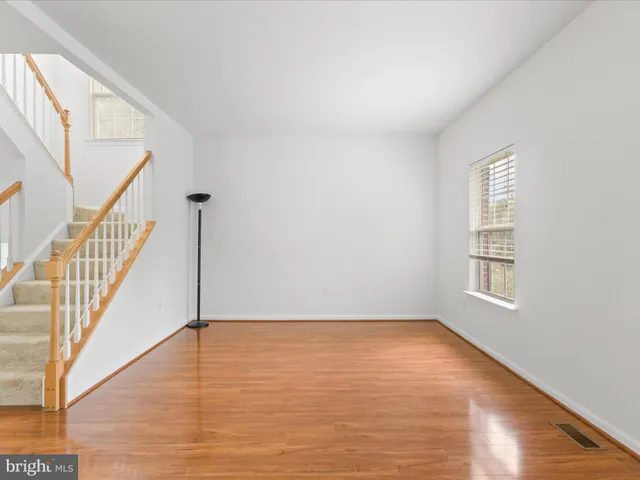a view of an entryway with wooden floor