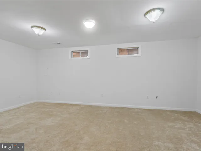 an empty room with a fan