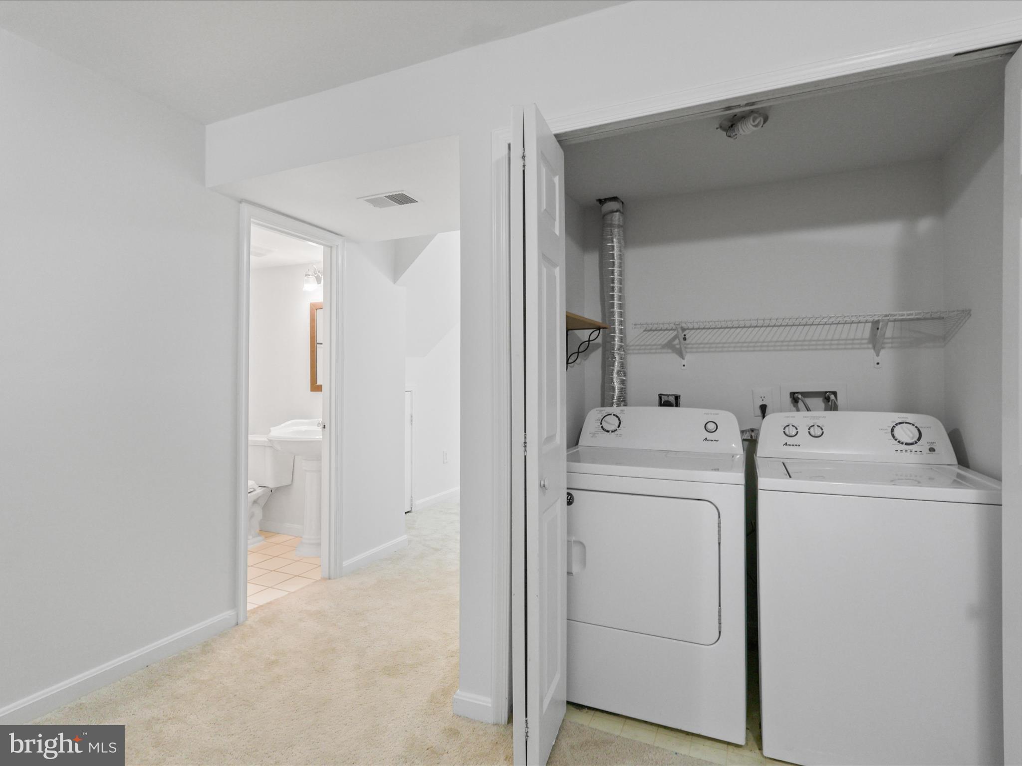 7700 Shadowcreek Terrace Springfield, VA 22153 - Photo 19 of 44 a view of storage and utility room with washer and dryer