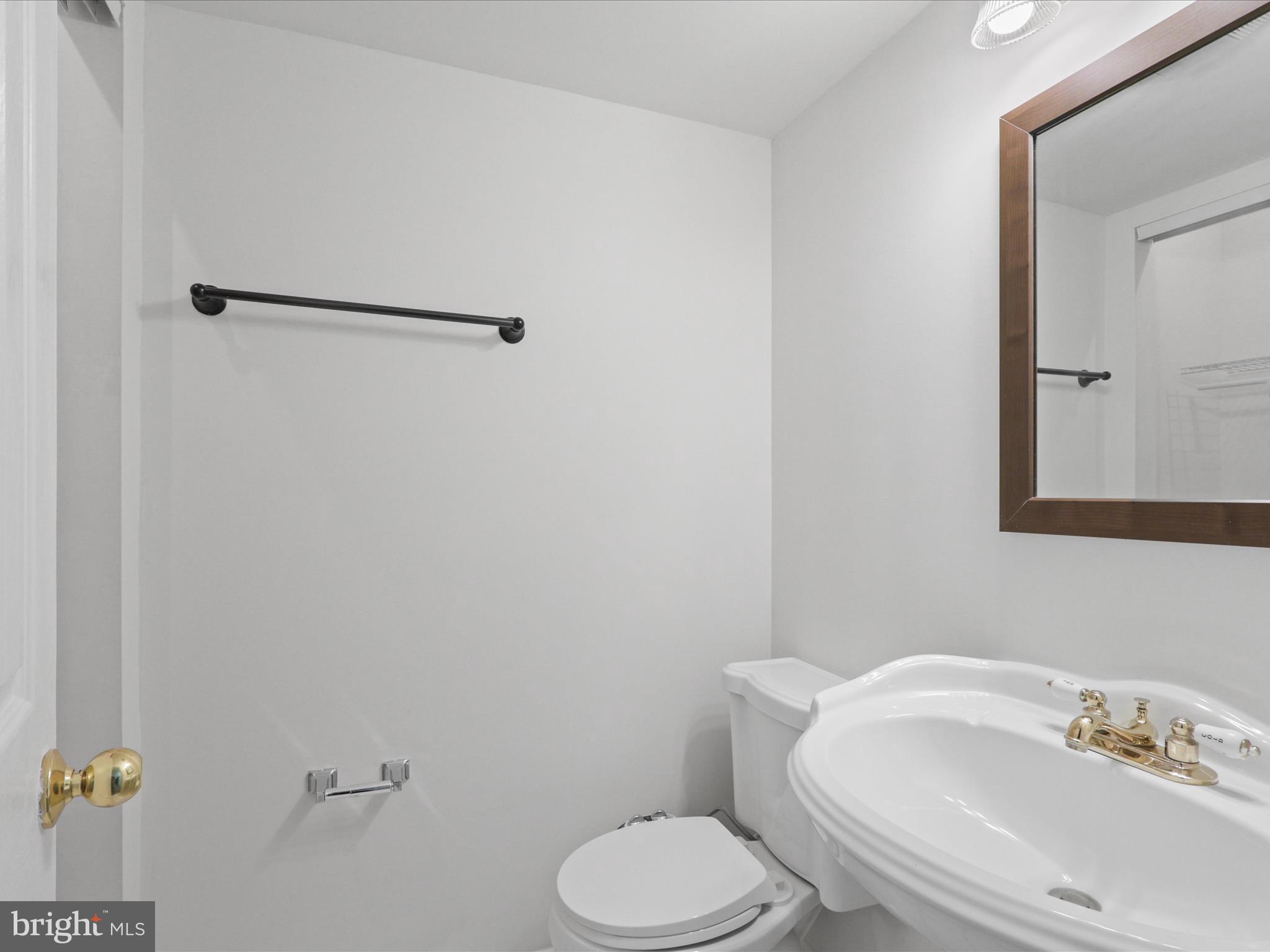 7700 Shadowcreek Terrace Springfield, VA 22153 - Photo 20 of 44 a white toilet sitting next to a bathroom sink