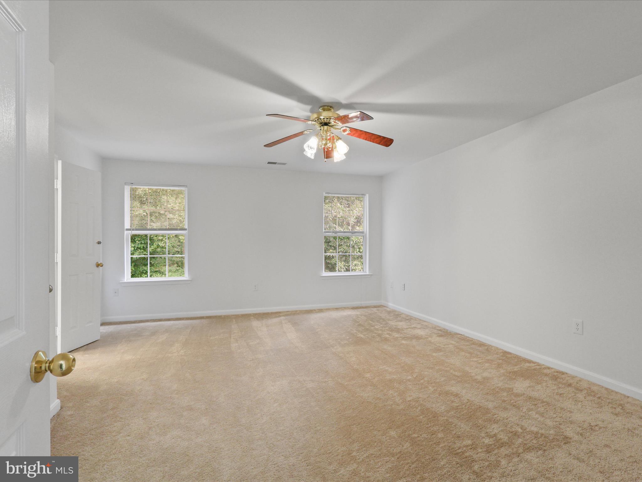7700 Shadowcreek Terrace Springfield, VA 22153 - Photo 23 of 44 an empty room with windows and fan