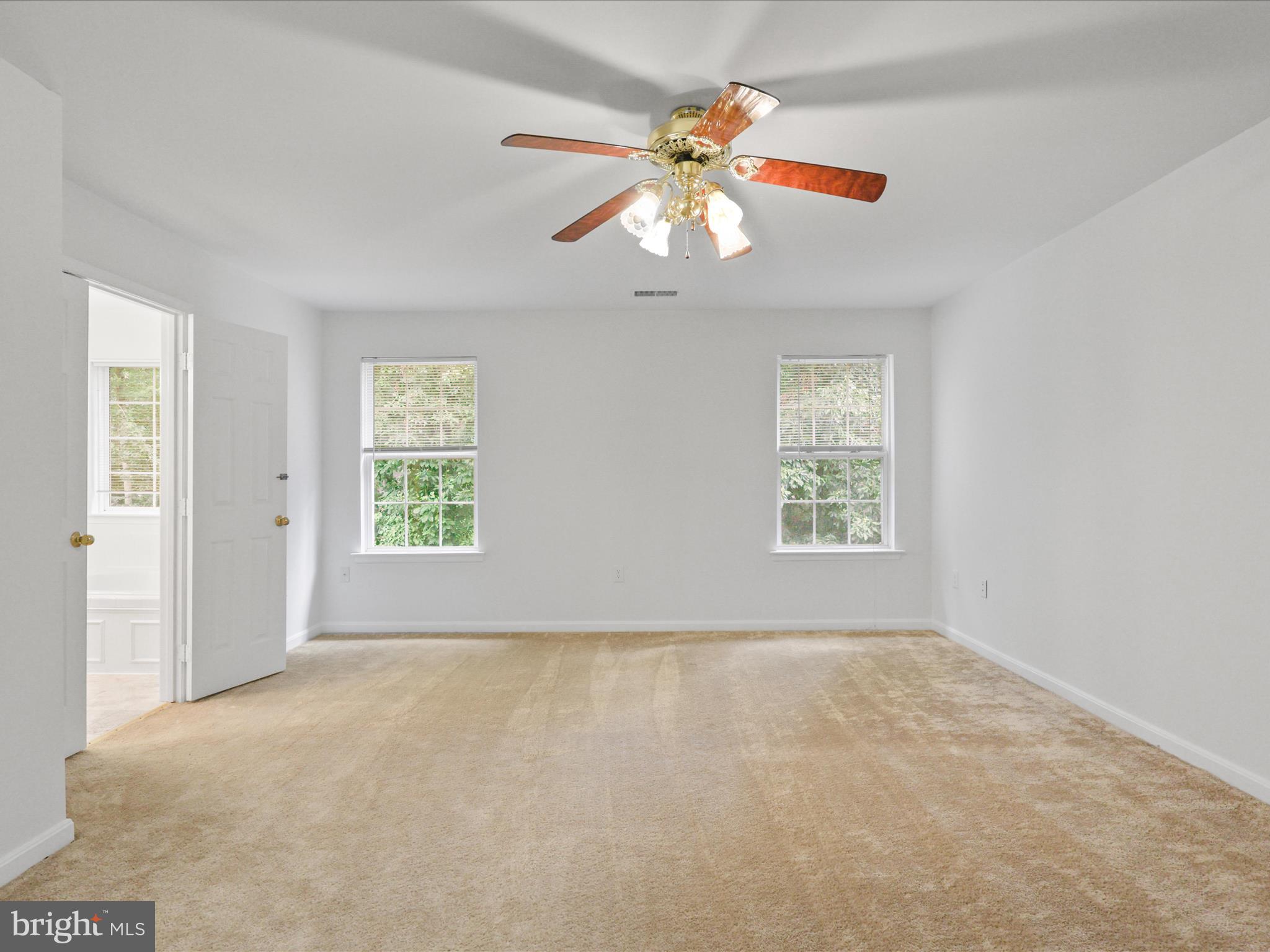 7700 Shadowcreek Terrace Springfield, VA 22153 - Photo 24 of 44 an empty room with windows and fan