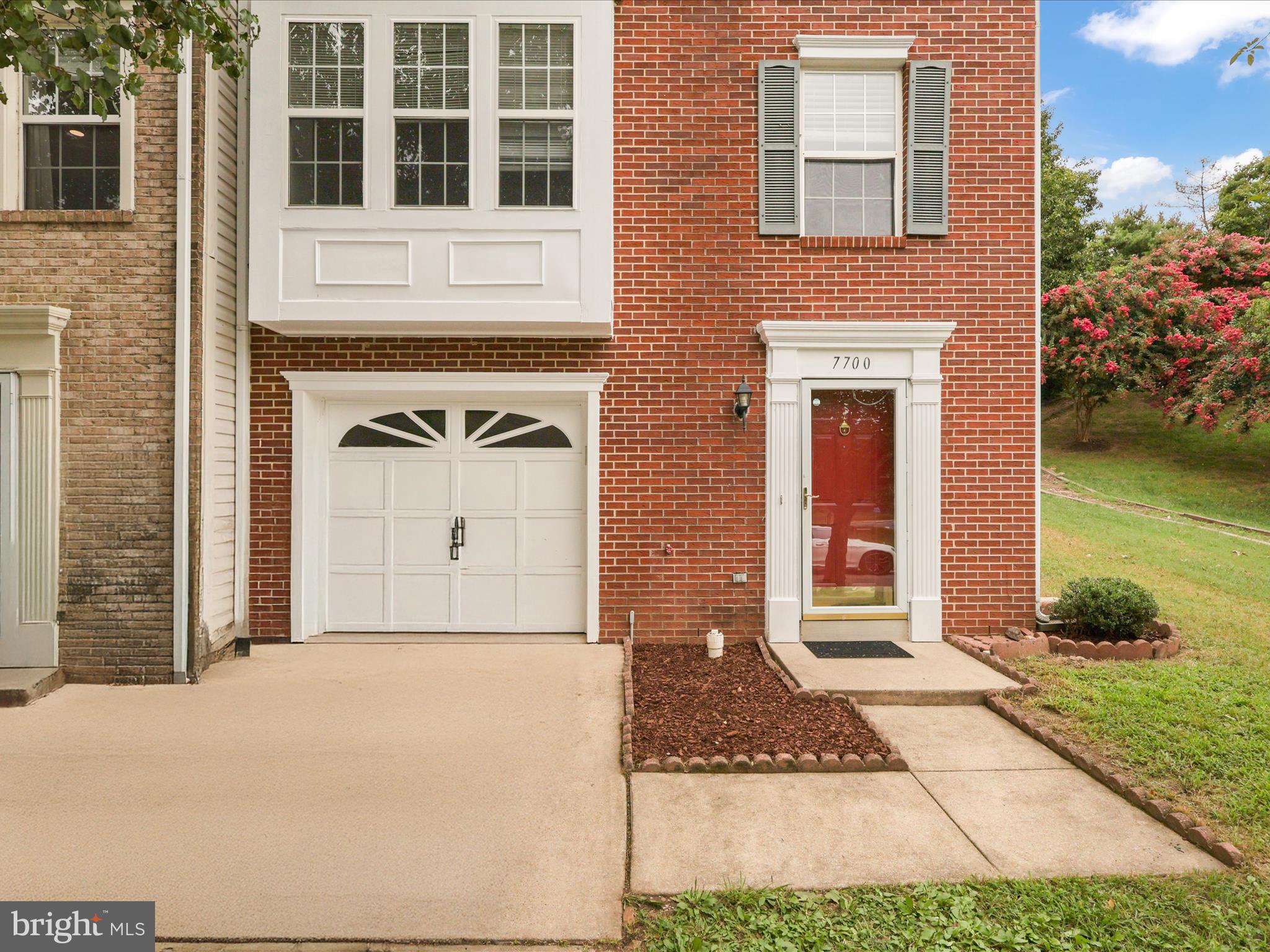 7700 Shadowcreek Terrace Springfield, VA 22153 - Photo 3 of 44 a front view of a house with garden