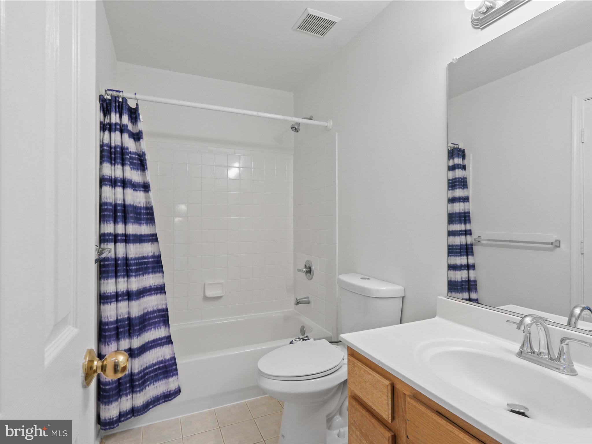 7700 Shadowcreek Terrace Springfield, VA 22153 - Photo 31 of 44 a bathroom with a sink a toilet and shower
