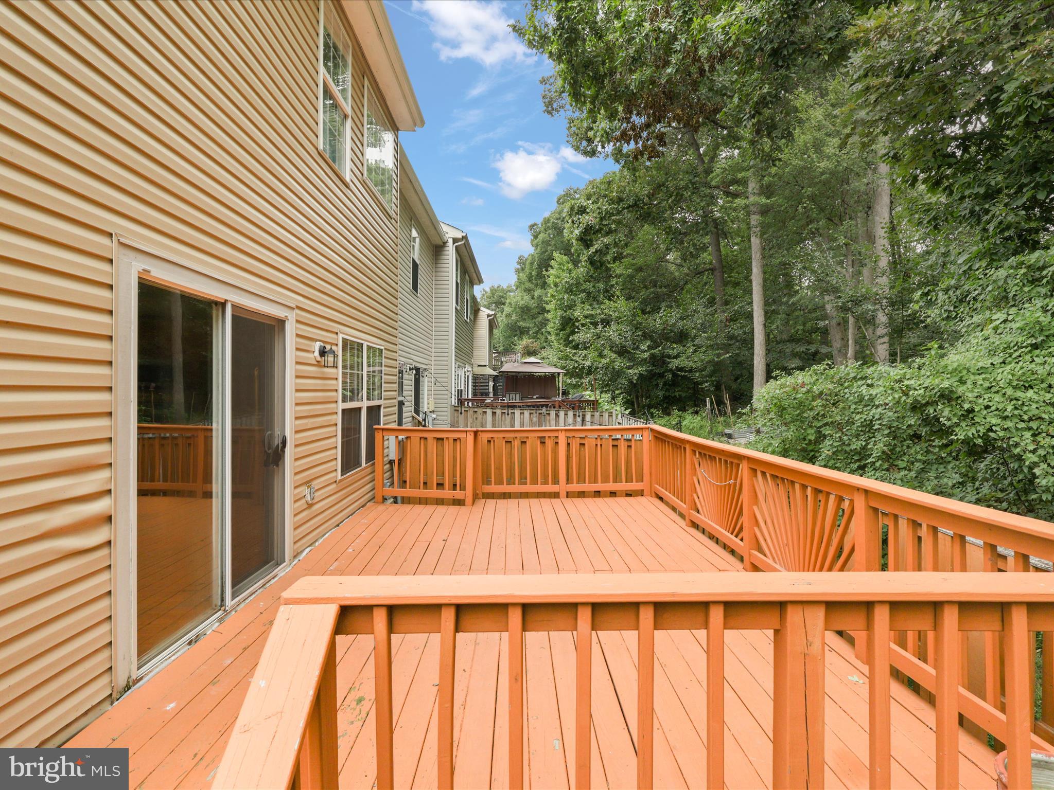 7700 Shadowcreek Terrace Springfield, VA 22153 - Photo 34 of 44 a view of balcony with wooden floor and fence
